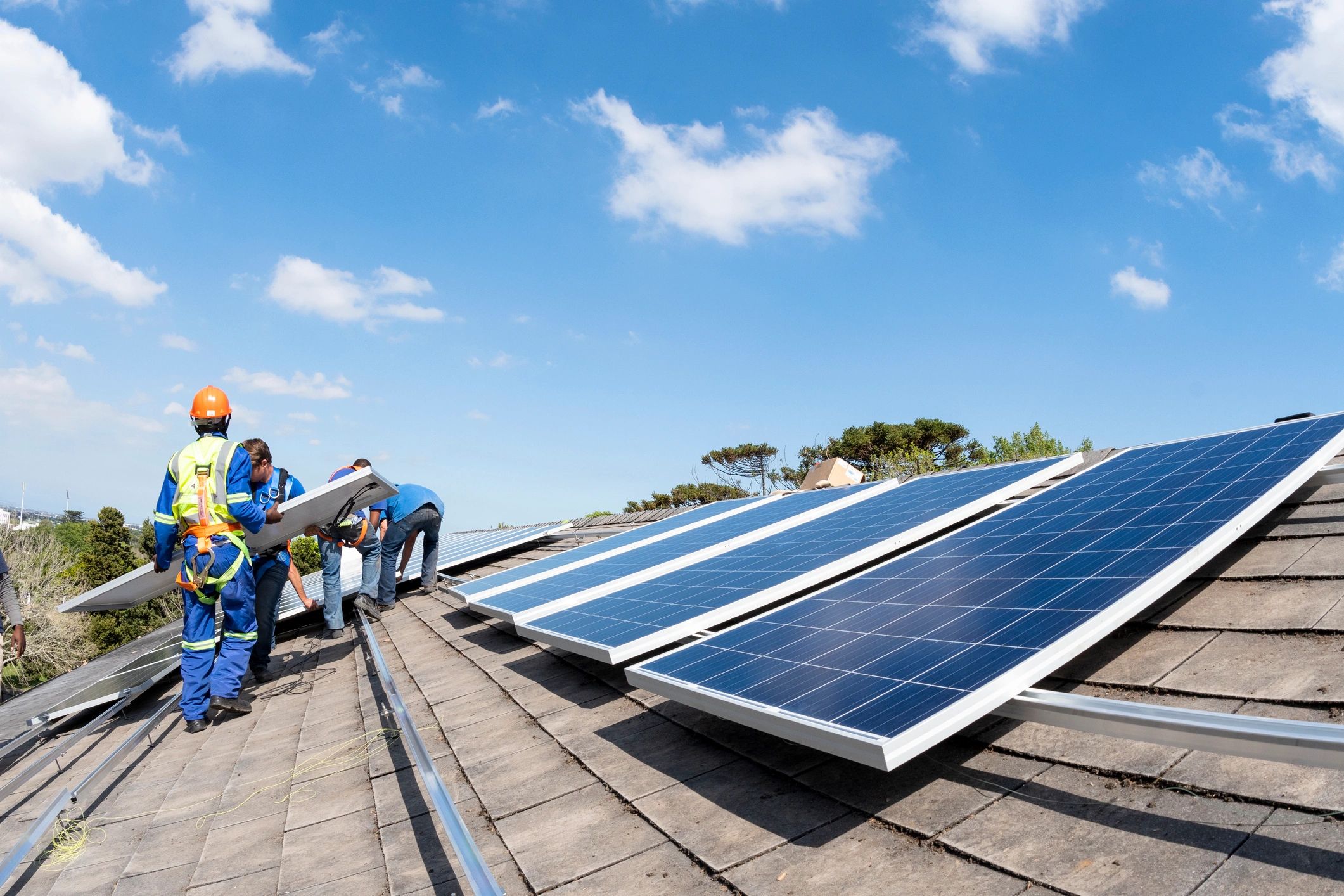 Team installing solar panels as part of a sustainable development project in Africa