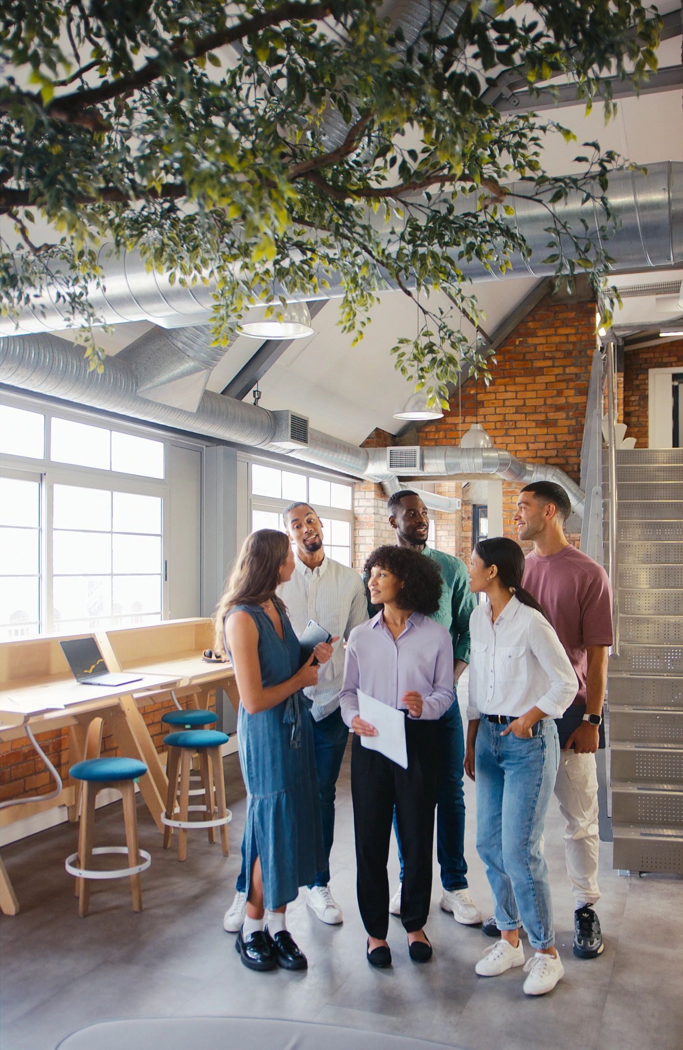 Partnerships lead standing with a multicultural team