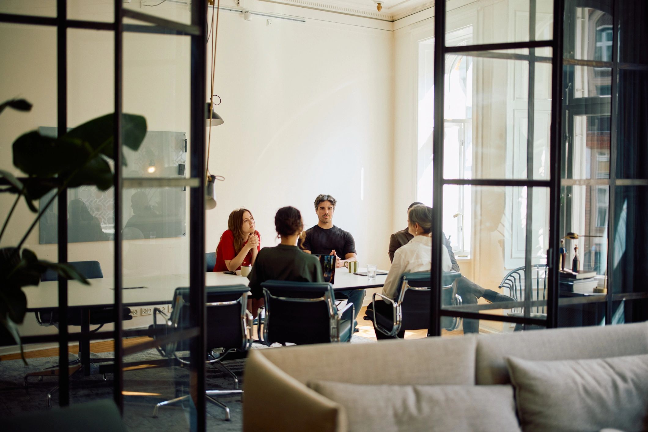 Professionals collaborating in a bright meeting space